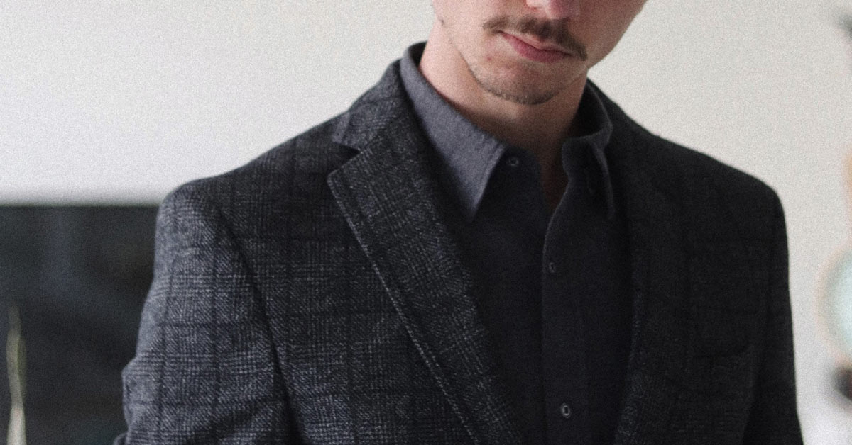 man wearing charcoal grey blazer