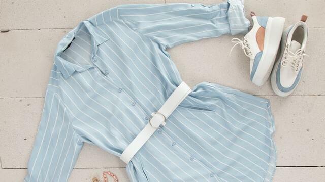 End of summers outfit: a collared shirt dress with a white belt and sneakers