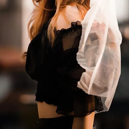 woman wearing an off shoulder ruffled top
