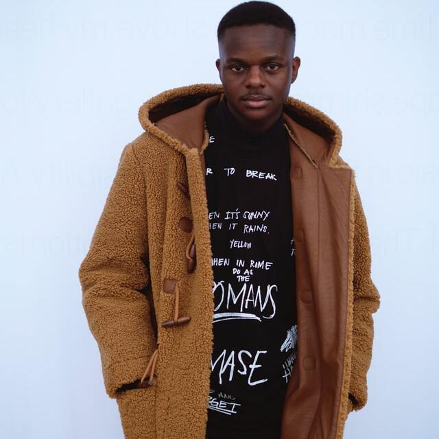 man wearing a brown suede jacket