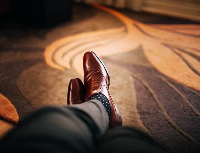 brown shoes with black pants