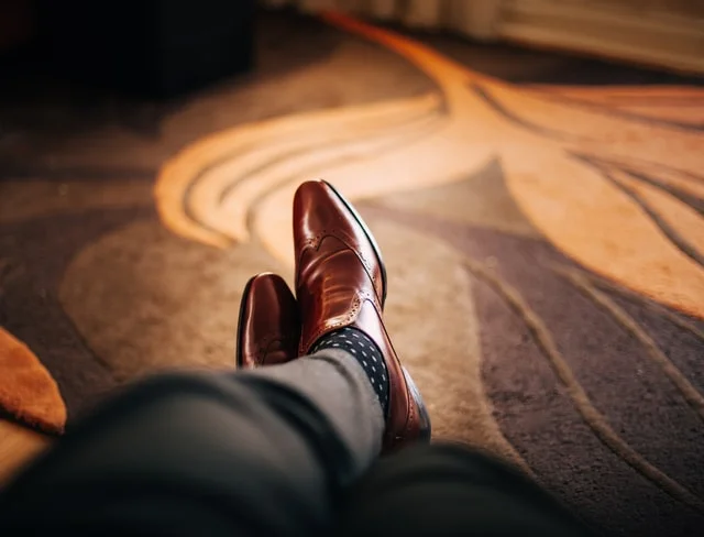 brown shoes with black pants