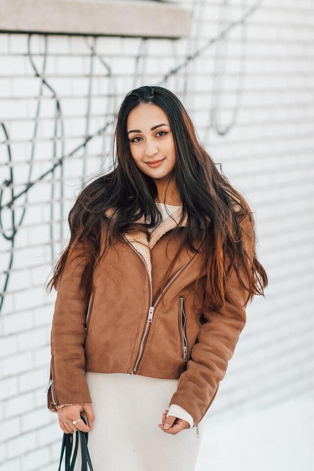girl wearing a brown motorcycle jacket