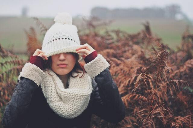 girl wearing a white beanie and scarf