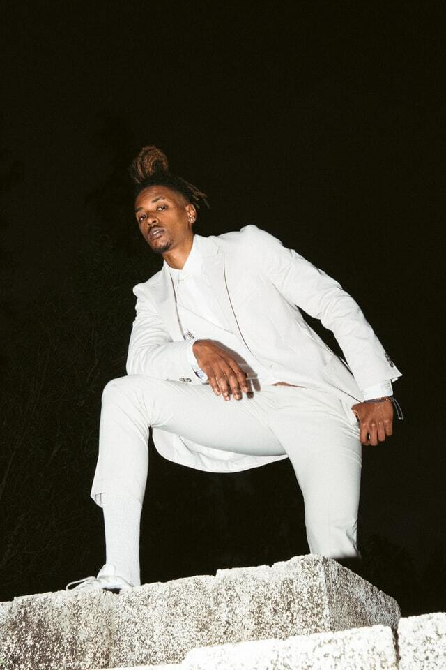 man wearing white suit