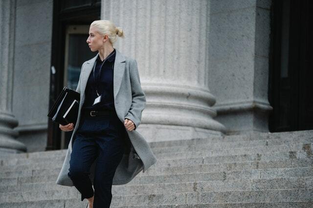 modern corporate attire with grey trench coat
