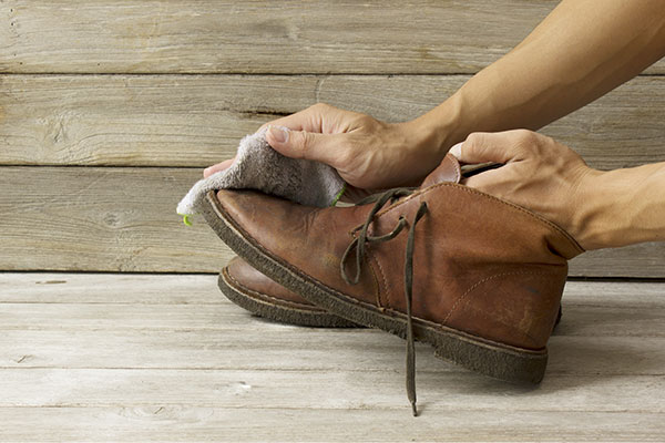 Cleaning a leather boot at home using cloth