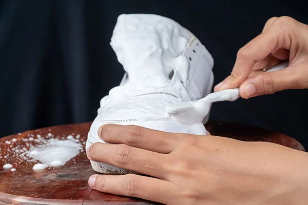 Clean a white leather boots detergent and brush